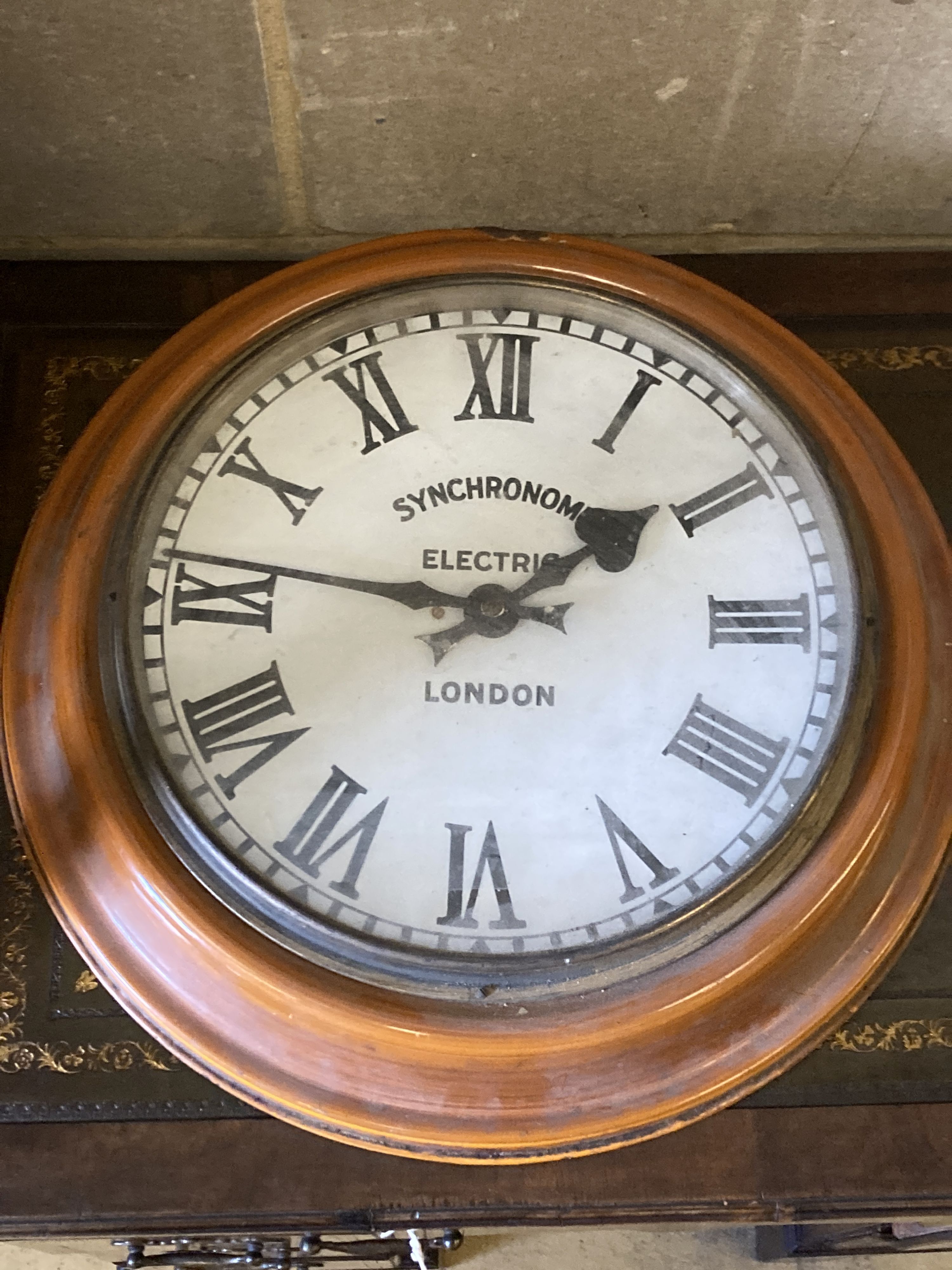 A Smiths English clock systems electric master clock in an arched oak case, with associated pendulum bob, marked ARN Serial No. 30505,